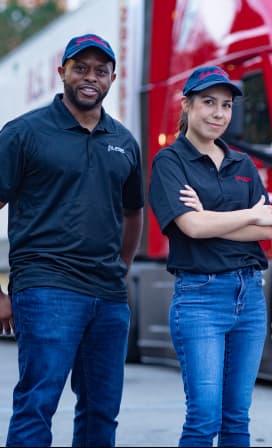 Black male driver and white female driver with black U.S. Xpress shirts